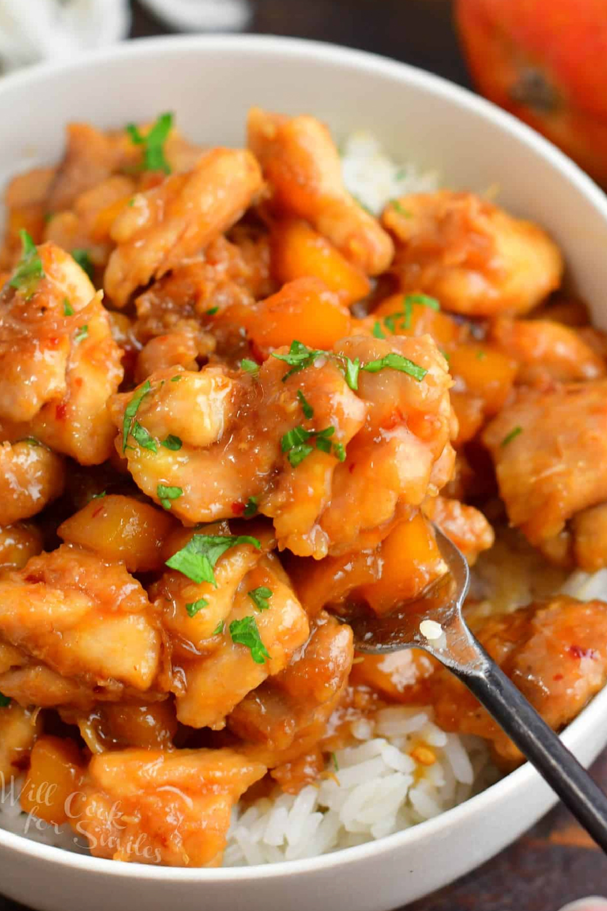 mango chicken and rice in bowl