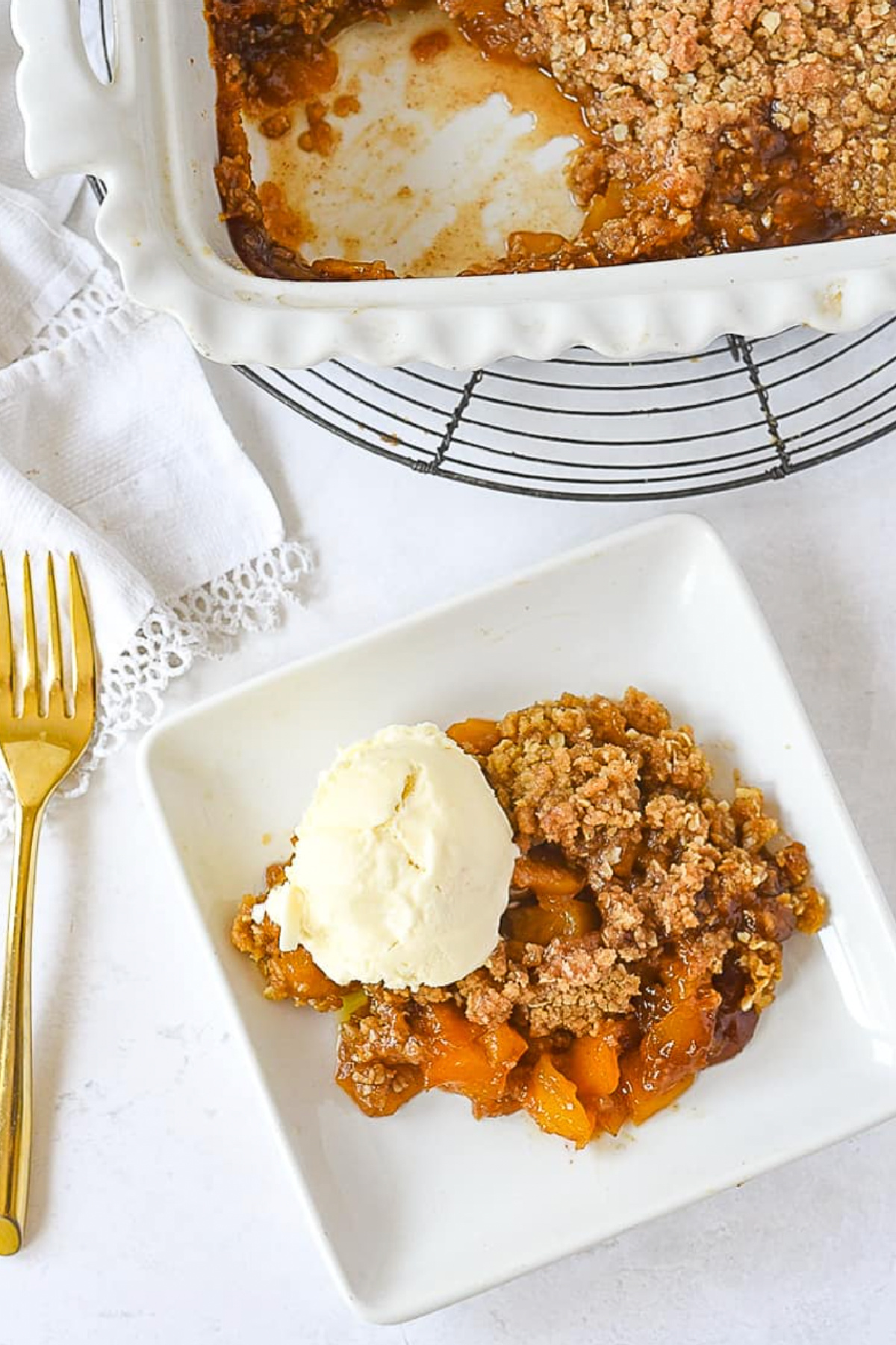 mango crumble on plate with ice cream