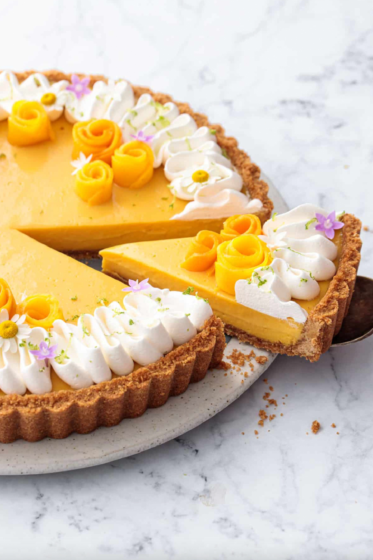 mango lime tart with slice cut out