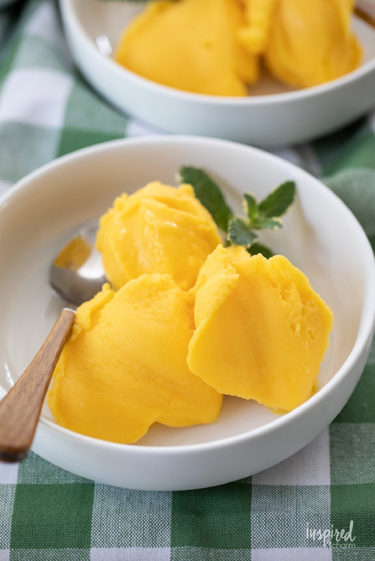 no churn mango sorbet in bowl with spoon