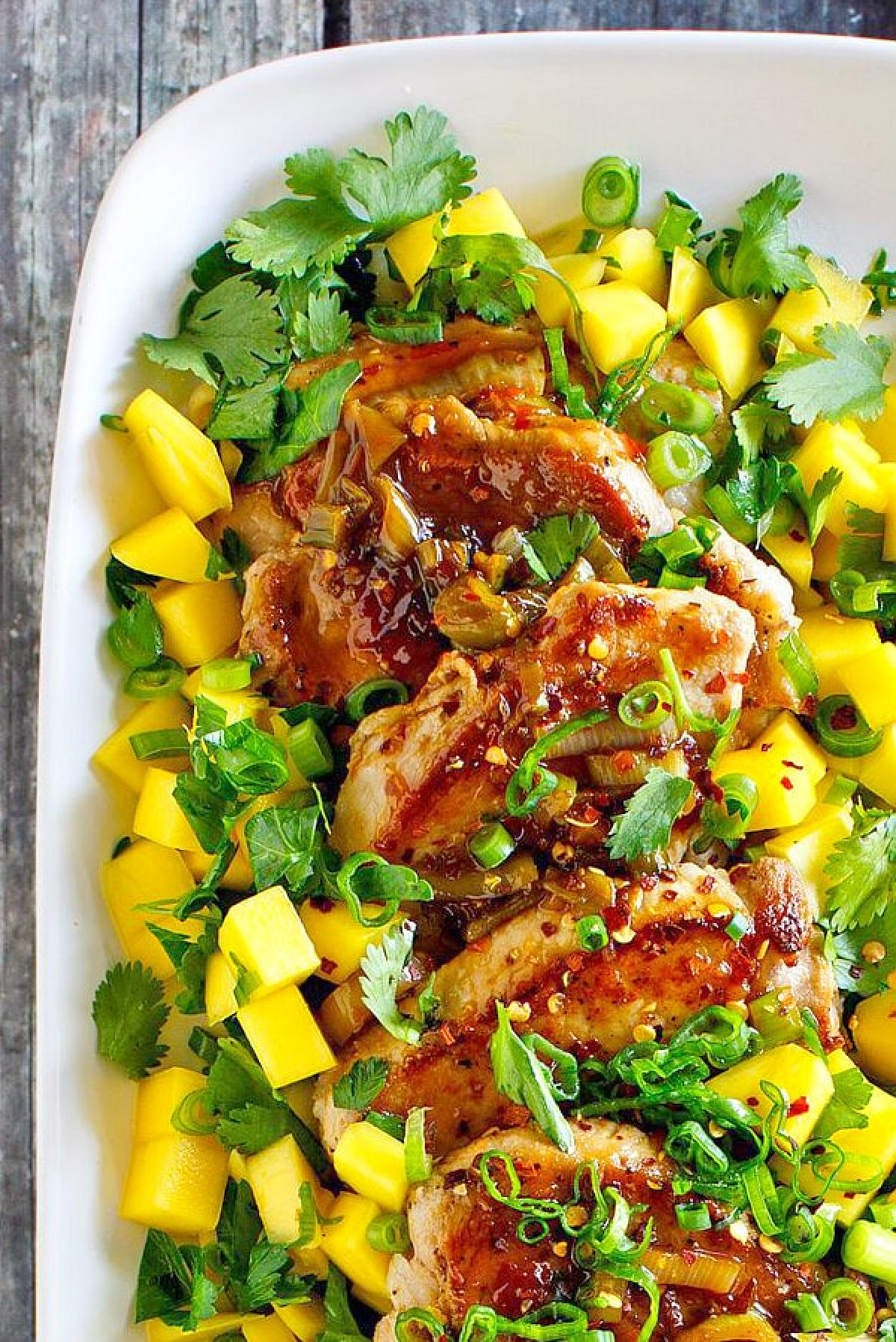 platter of pork tenderloin with mango lime salsa