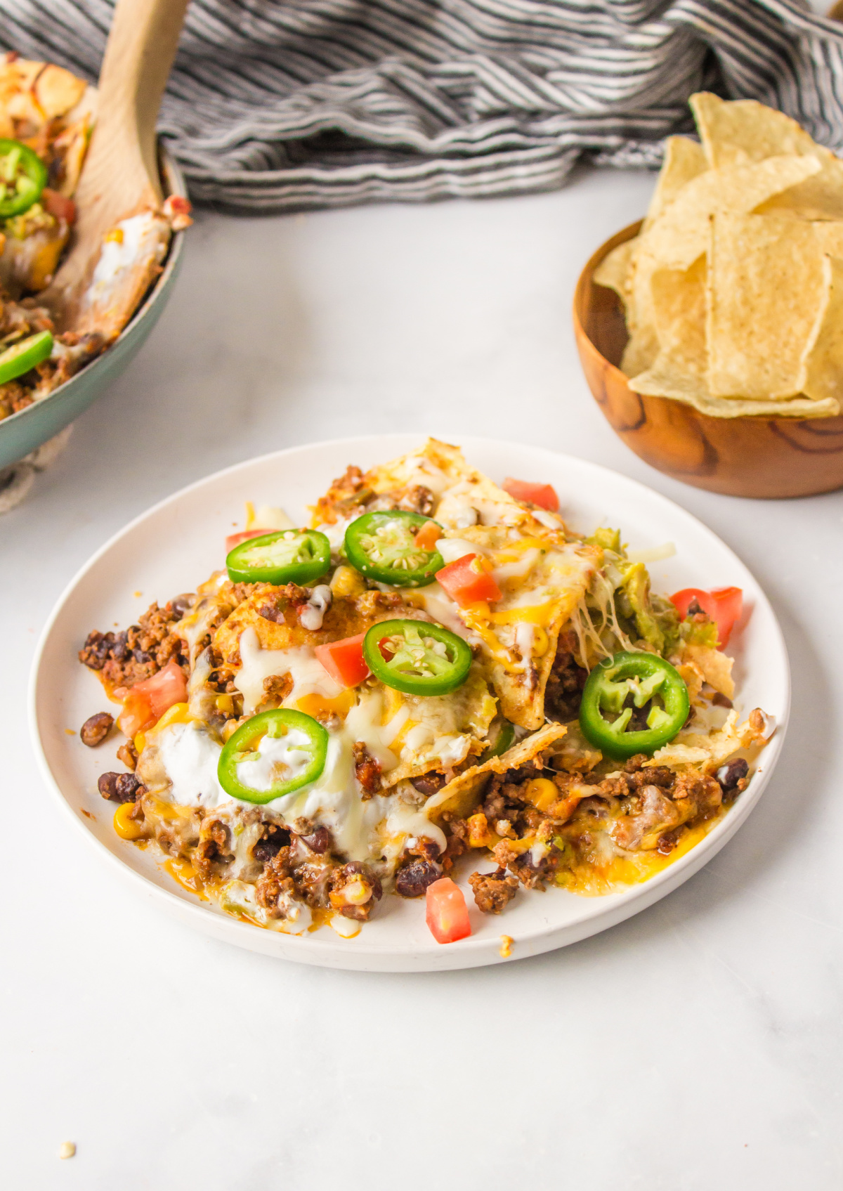 serving of nachos on plate