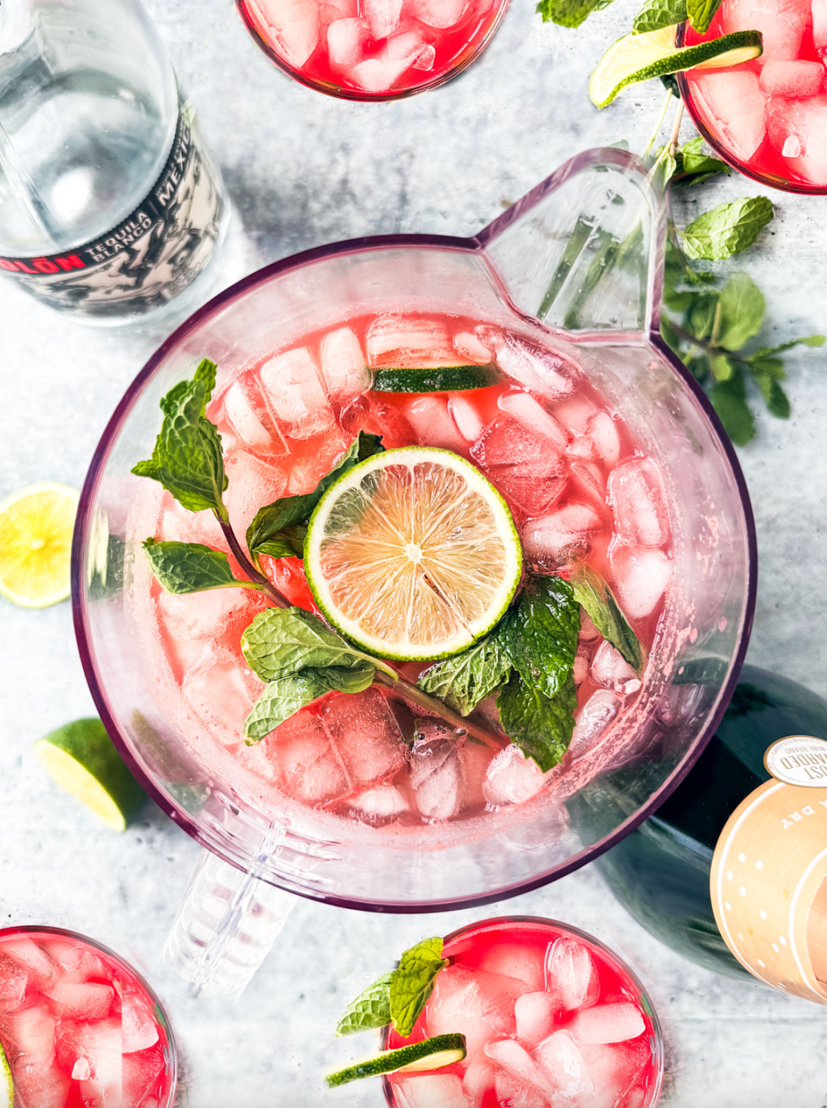 overhead shot of pitcher of watermelon sangria with prosecco