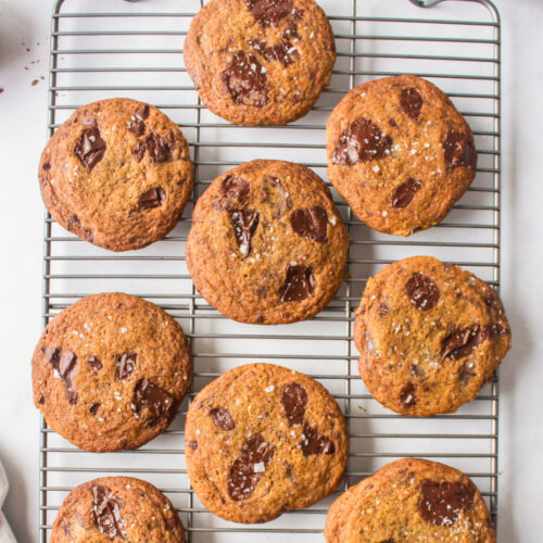 dark chocolate chunk cookies on a baking rack