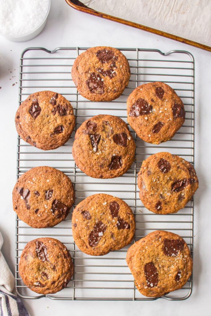 dark chocolate chunk cookies on a baking rack