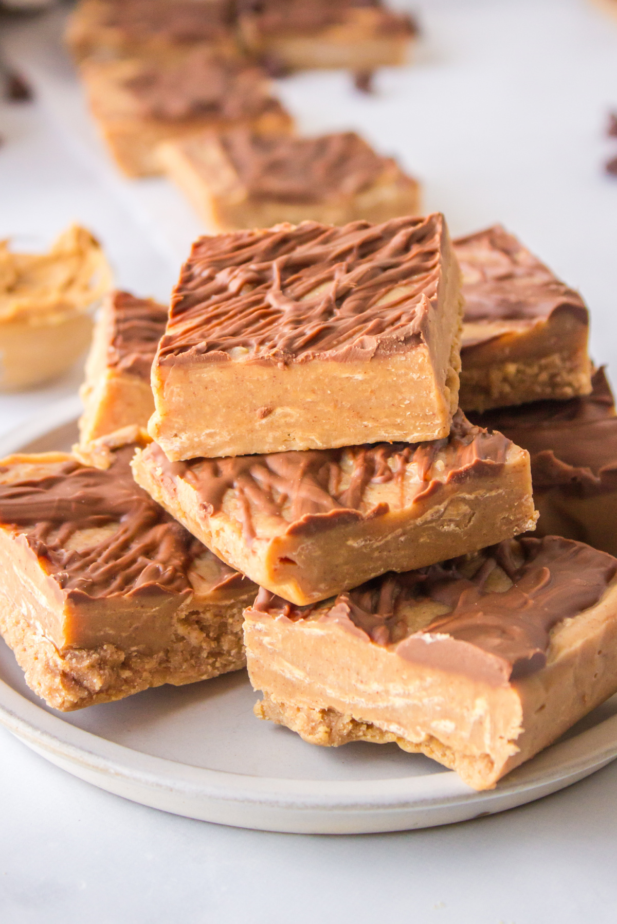 creamy peanut butter fudge stacked on platter