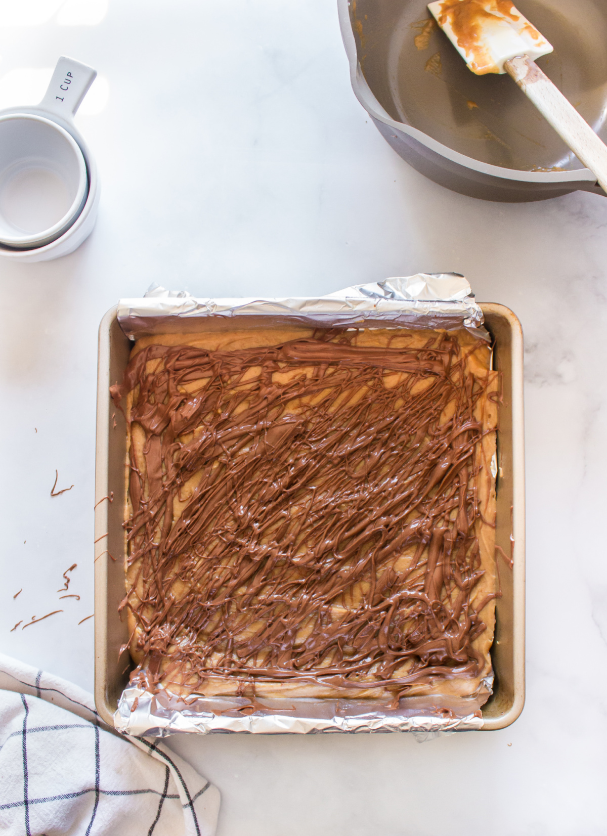 creamy peanut butter fudge with chocolate swirl in pan