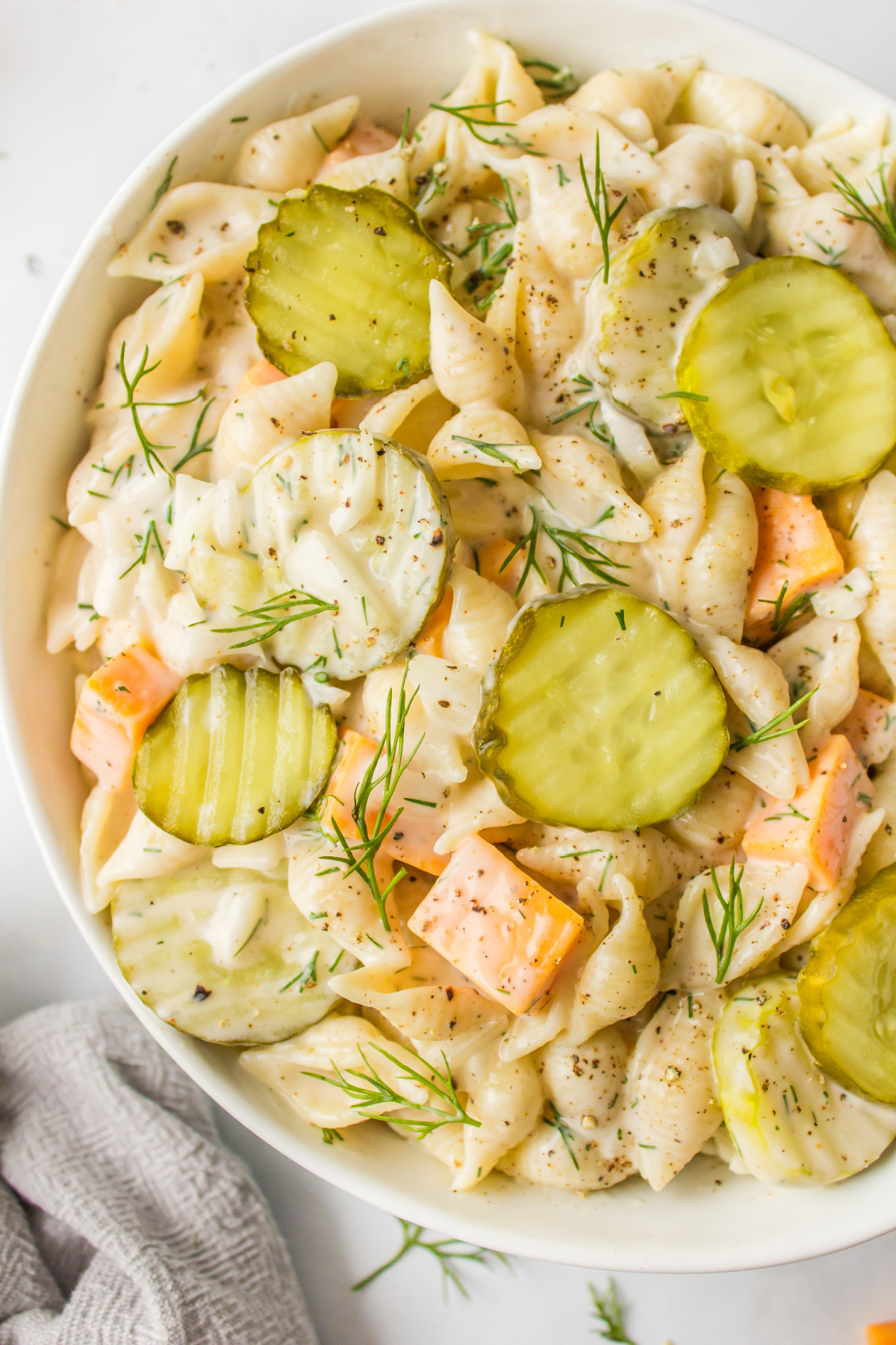 close up side of bowl of dill pickle pasta salad