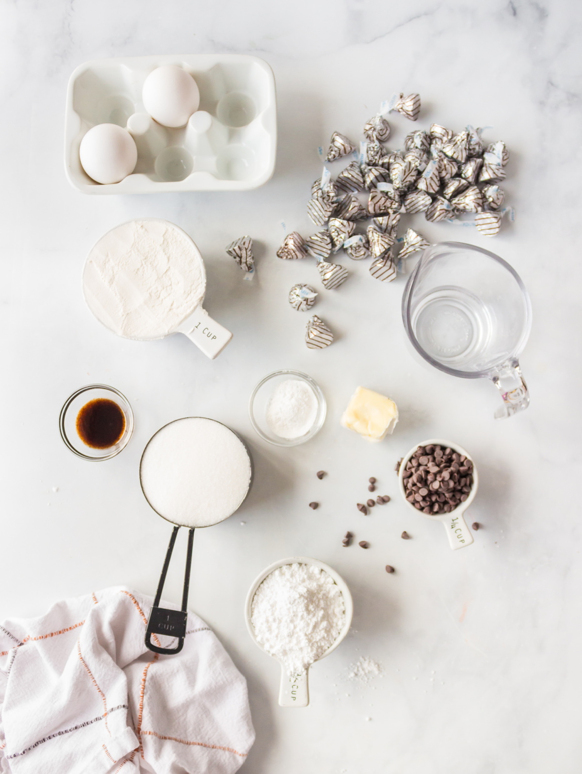 ingredients displayed for making chocolate kiss crinkle cookies