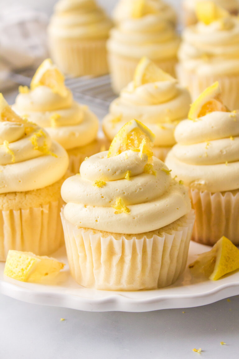 lemon cupcakes with lemon frosting on platter