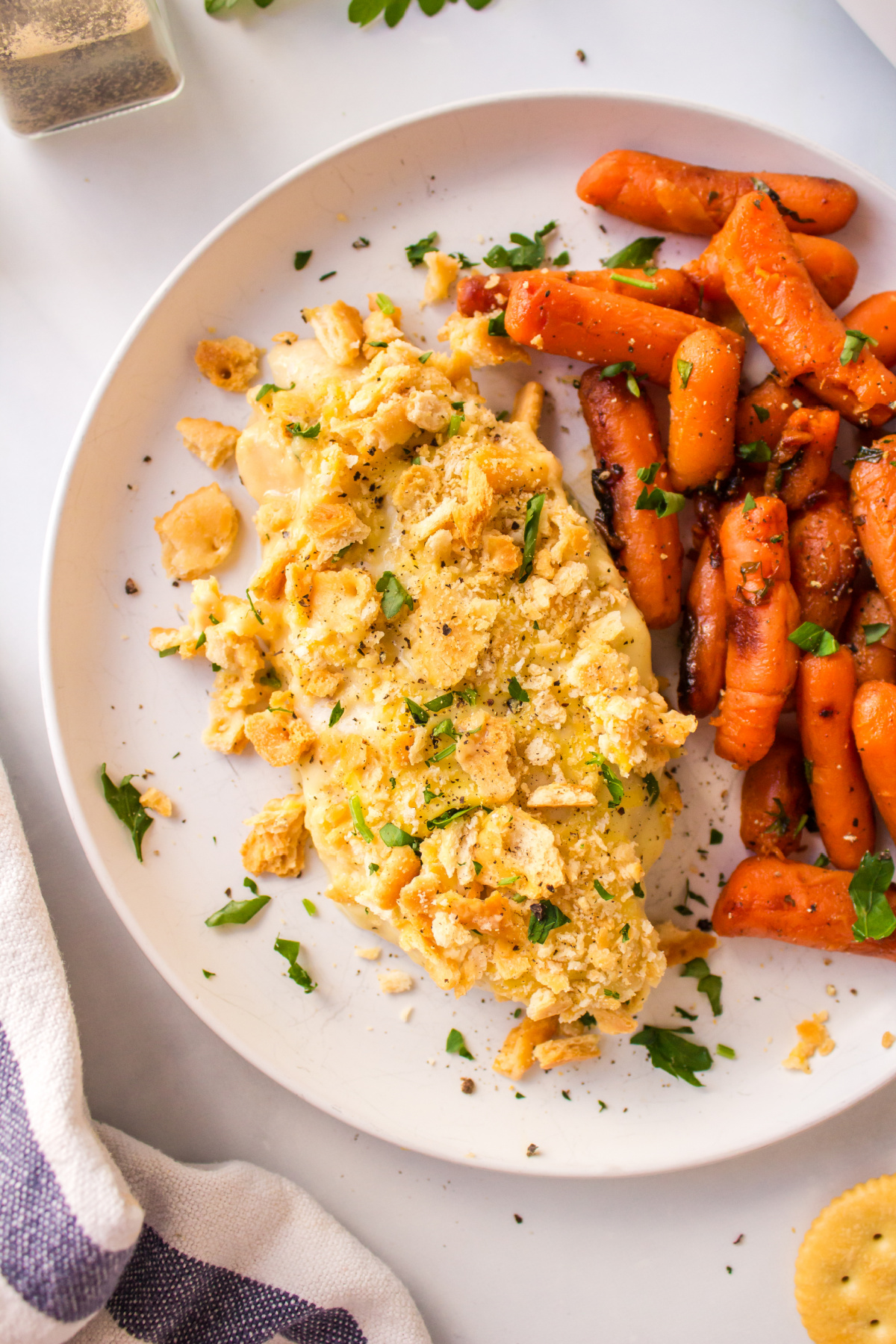 plating of swiss cheese chicken with carrots