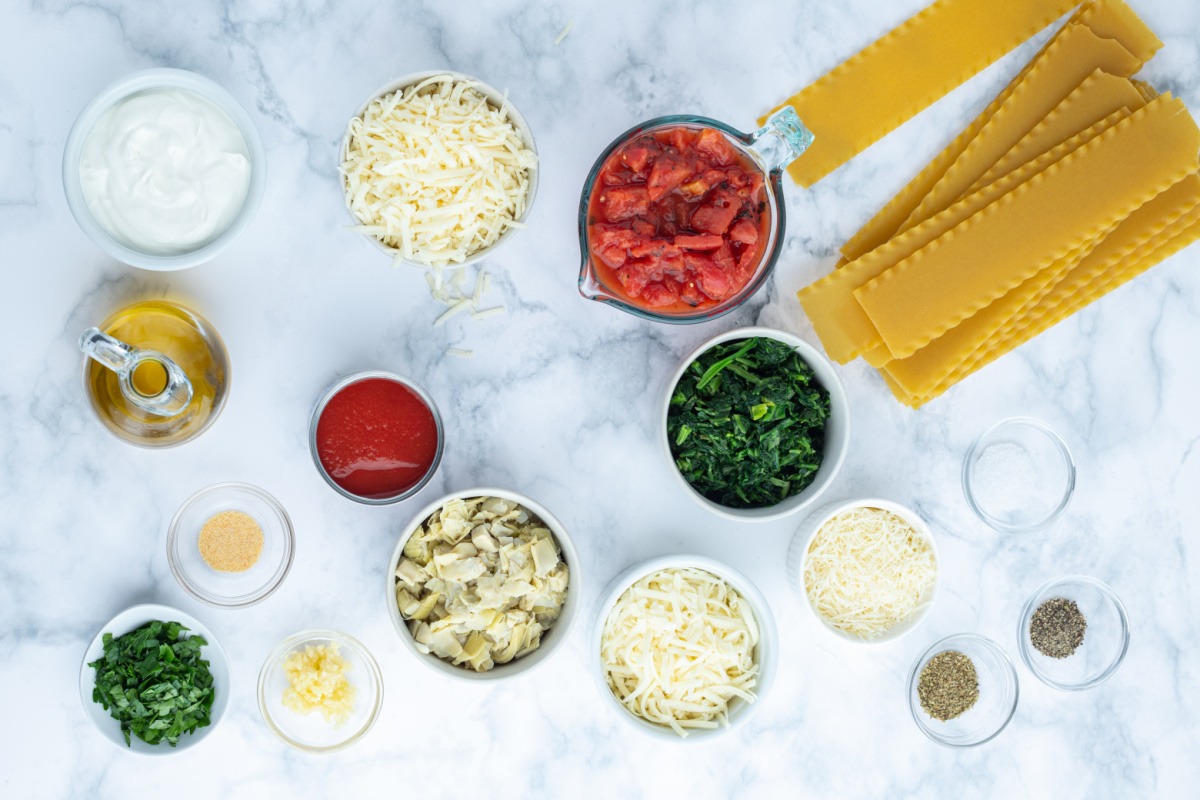 ingredients displayed for making spinach artichoke lasagna